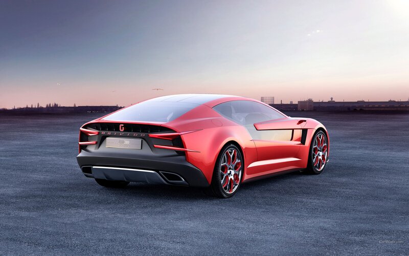 Red sports car on tarmac