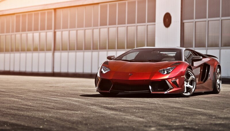red sports car on tarmac