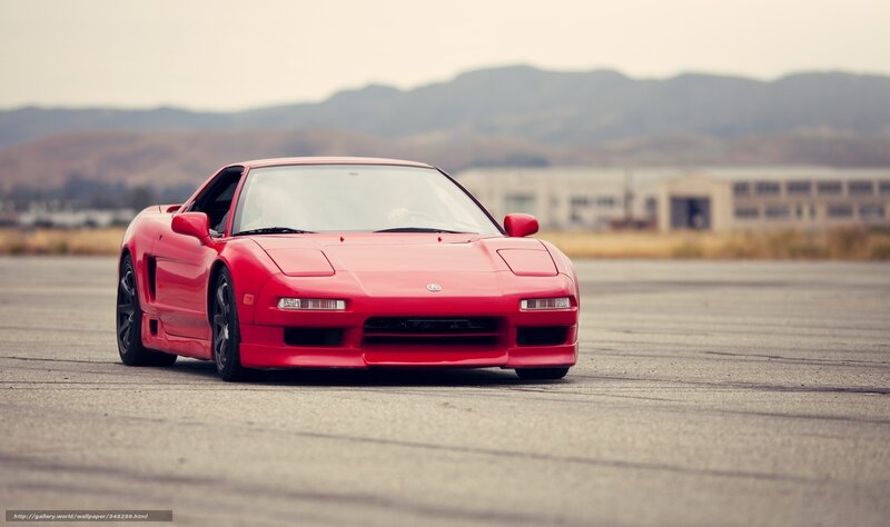 Red sports car on tarmac