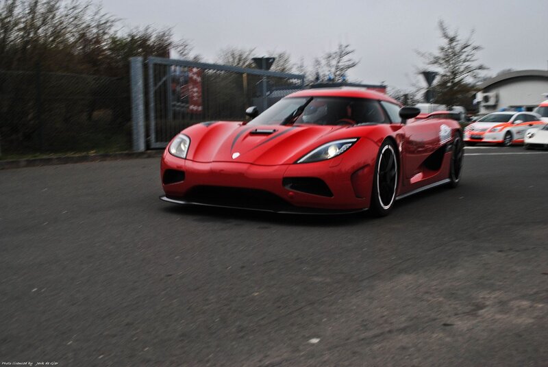 red sports car on track