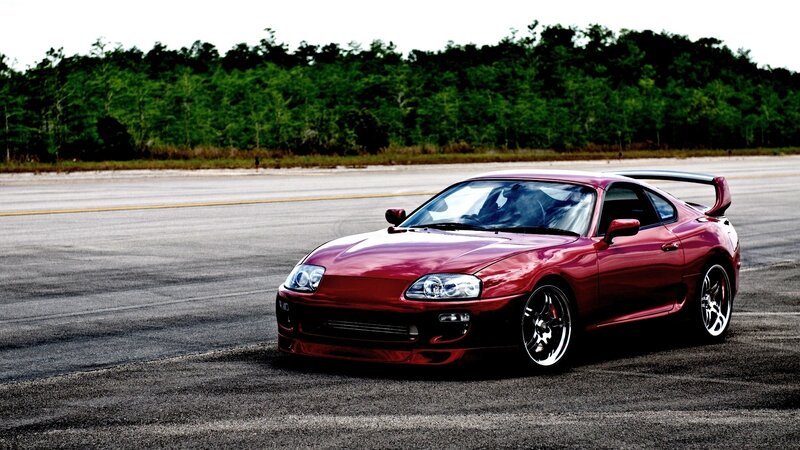 red sports car on track