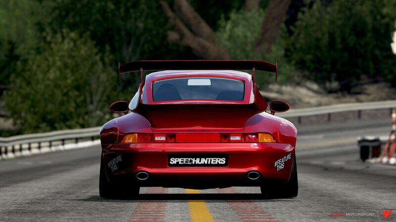 red sports car on track
