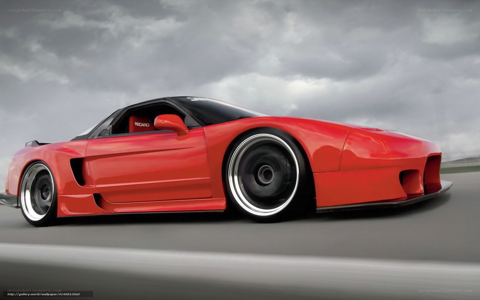 red sports car on track