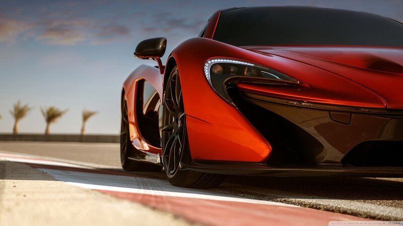 Red Sports Car on Track — Dramatic, Sky