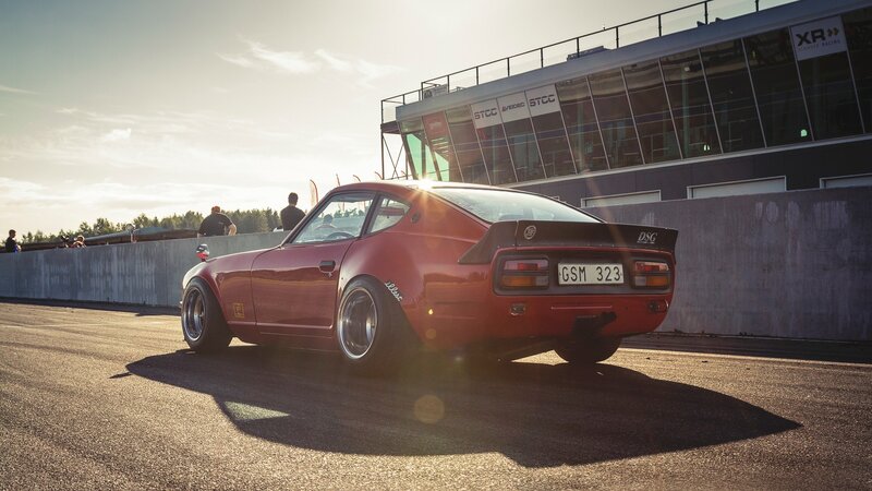 Red Sports Car on Track — Dramatic, Sunset, Photograph, Race Track