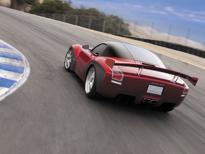 Red Sports Car on Track — Dynamic, Afternoon, Photograph, Race Track, Tire Barrier