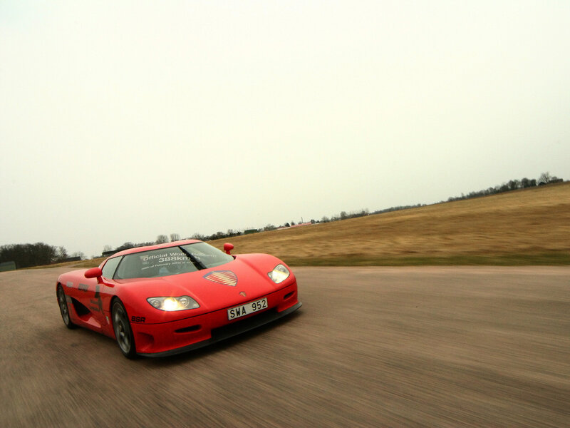 Red Sports Car on Track — Dynamic, Morning