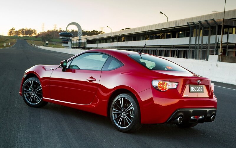 Red Sports Car on Track — Dynamic, Sunset, Photograph, Race Track