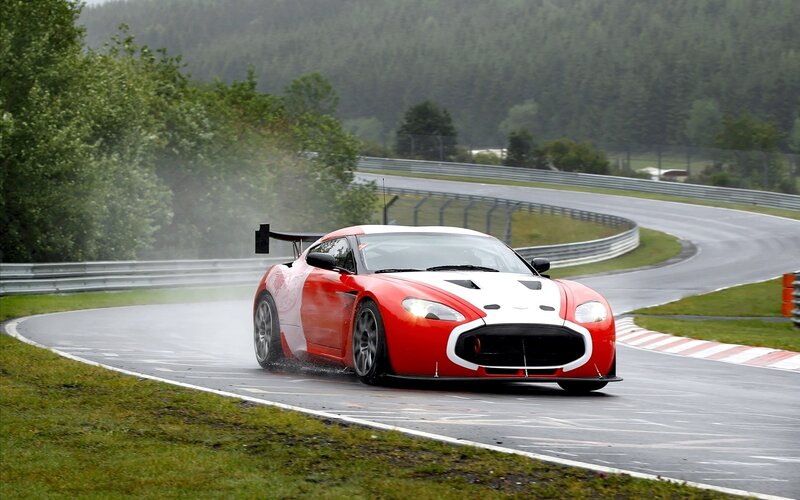 Red sports car on wet racetrack