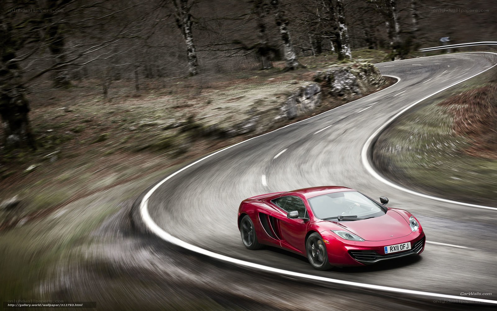 Red sports car on winding road