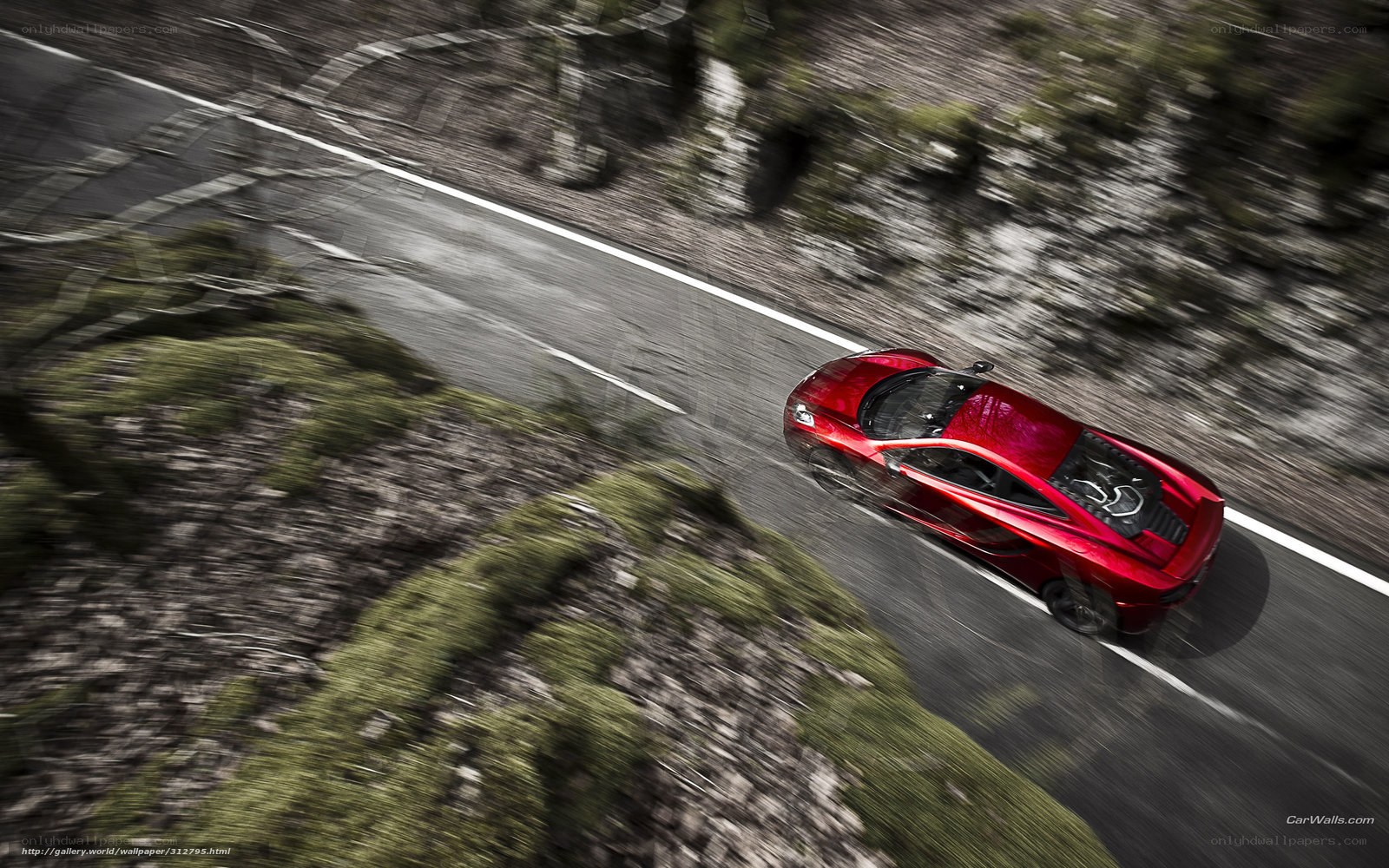 Red sports car on winding road