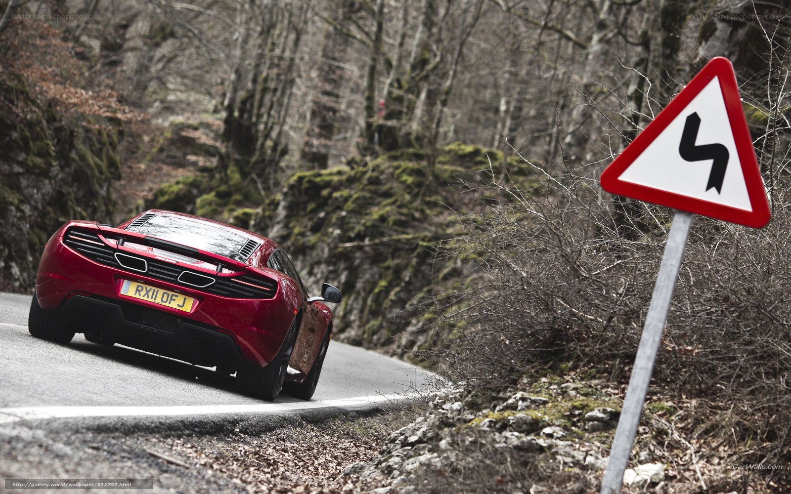 red sports car on winding road