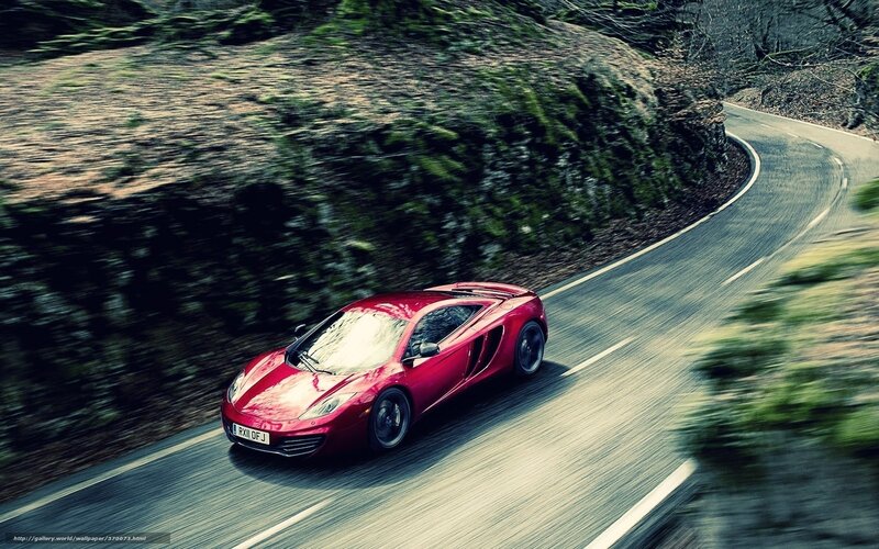 red sports car on winding road