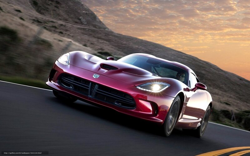 red sports car on winding road