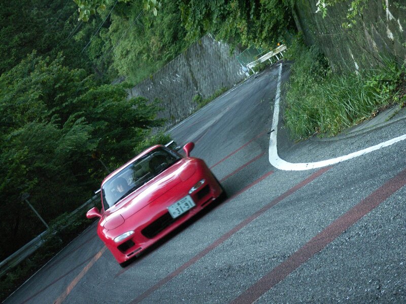 Red sports car on winding road
