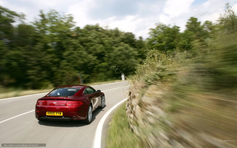 red sports car on winding road