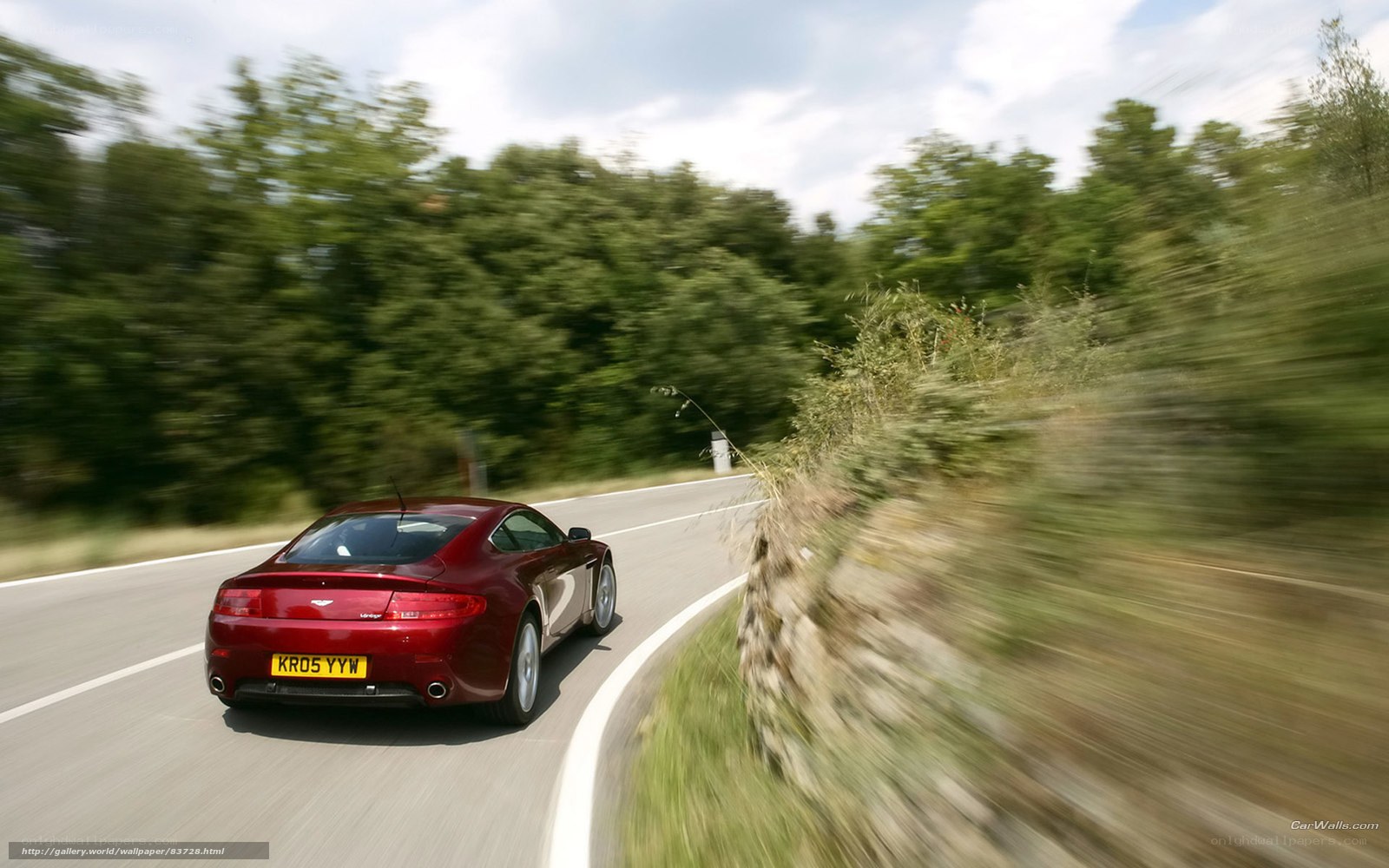 red sports car on winding road