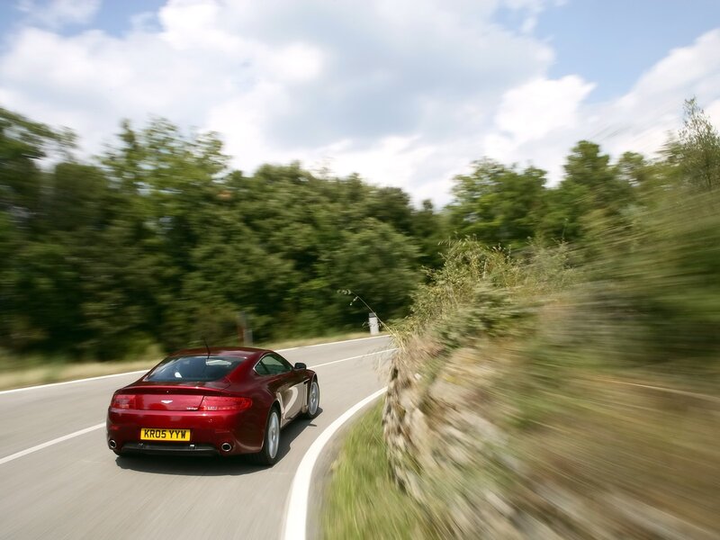 red sports car on winding road