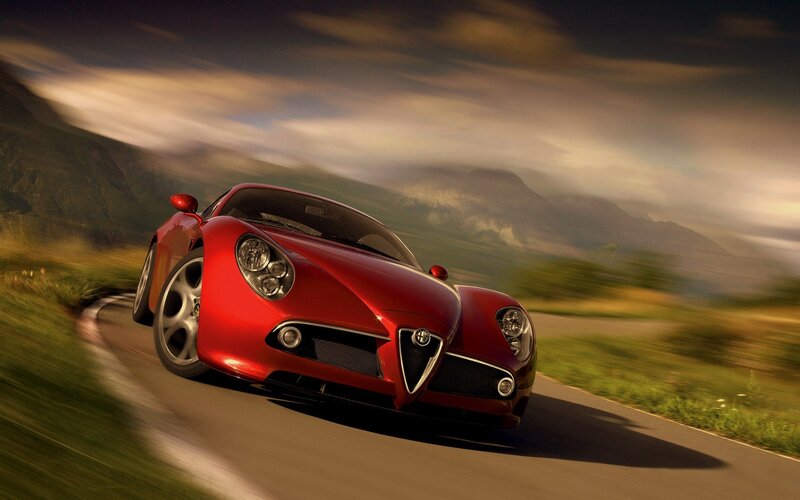 Red sports car on winding road