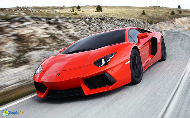 red sports car on winding road