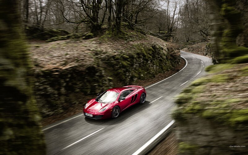 red sports car on winding road
