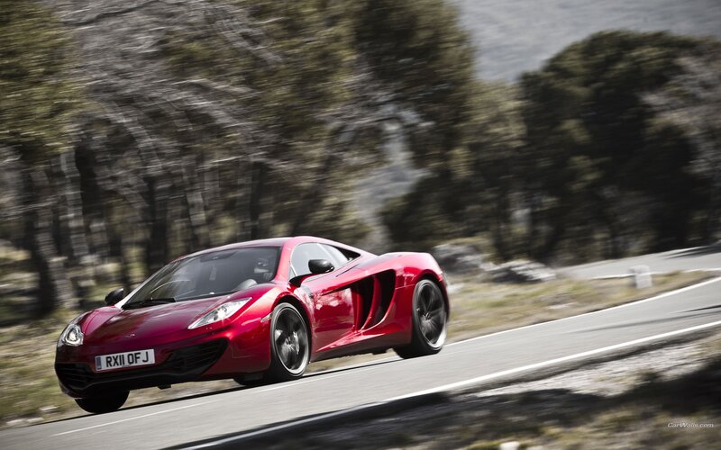 red sports car on winding road