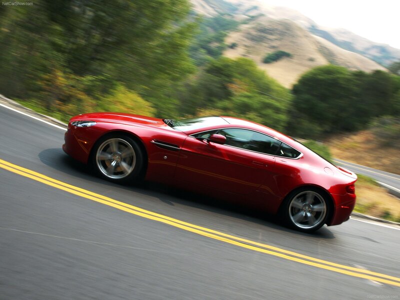 red sports car on winding road
