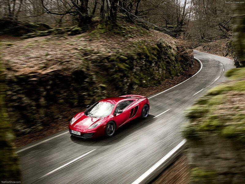 red sports car on winding road