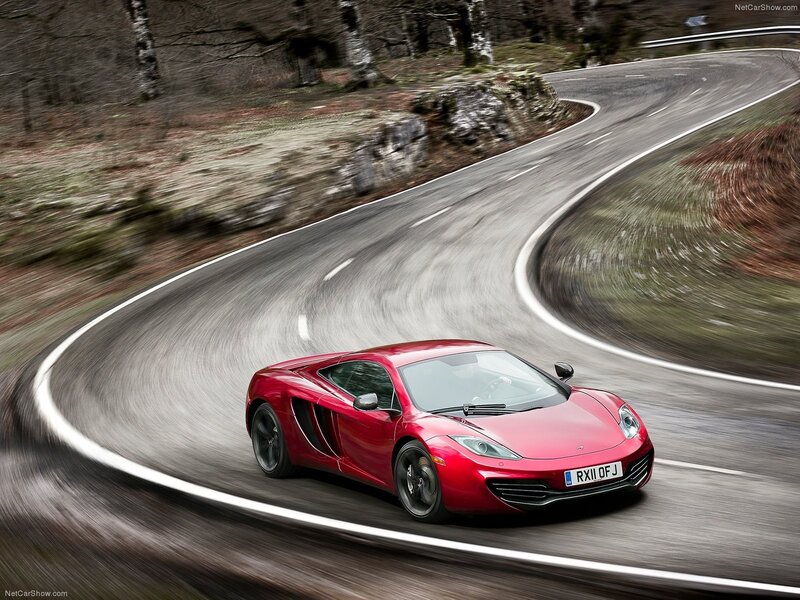 red sports car on winding road