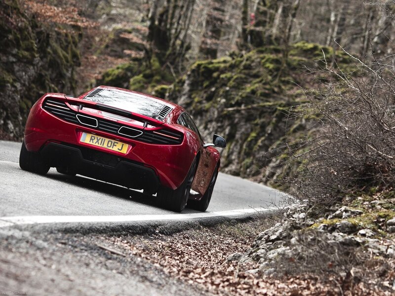 red sports car on winding road