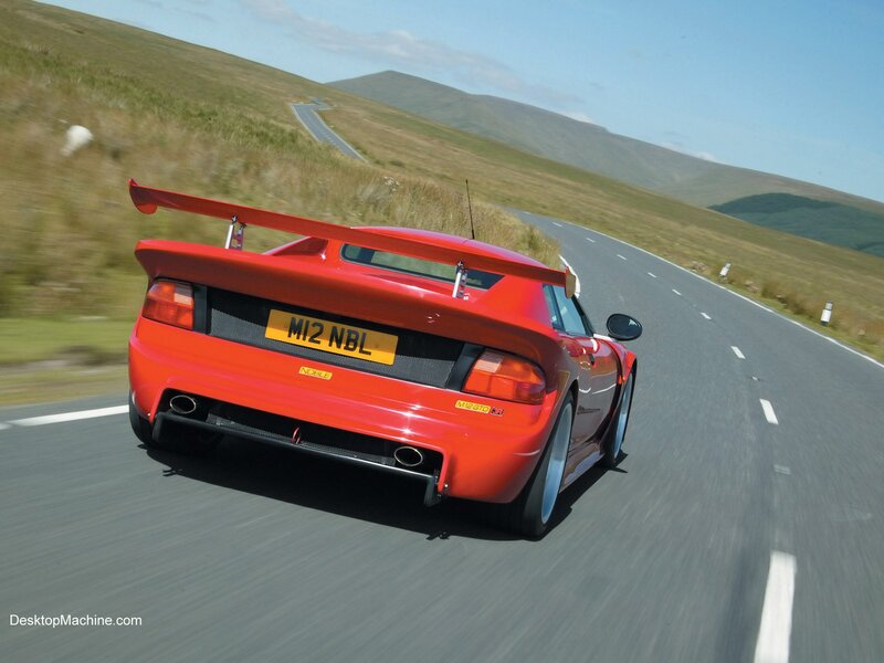 red sports car on winding road