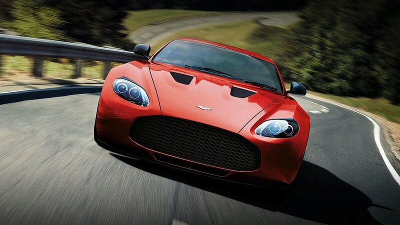 red sports car on winding road