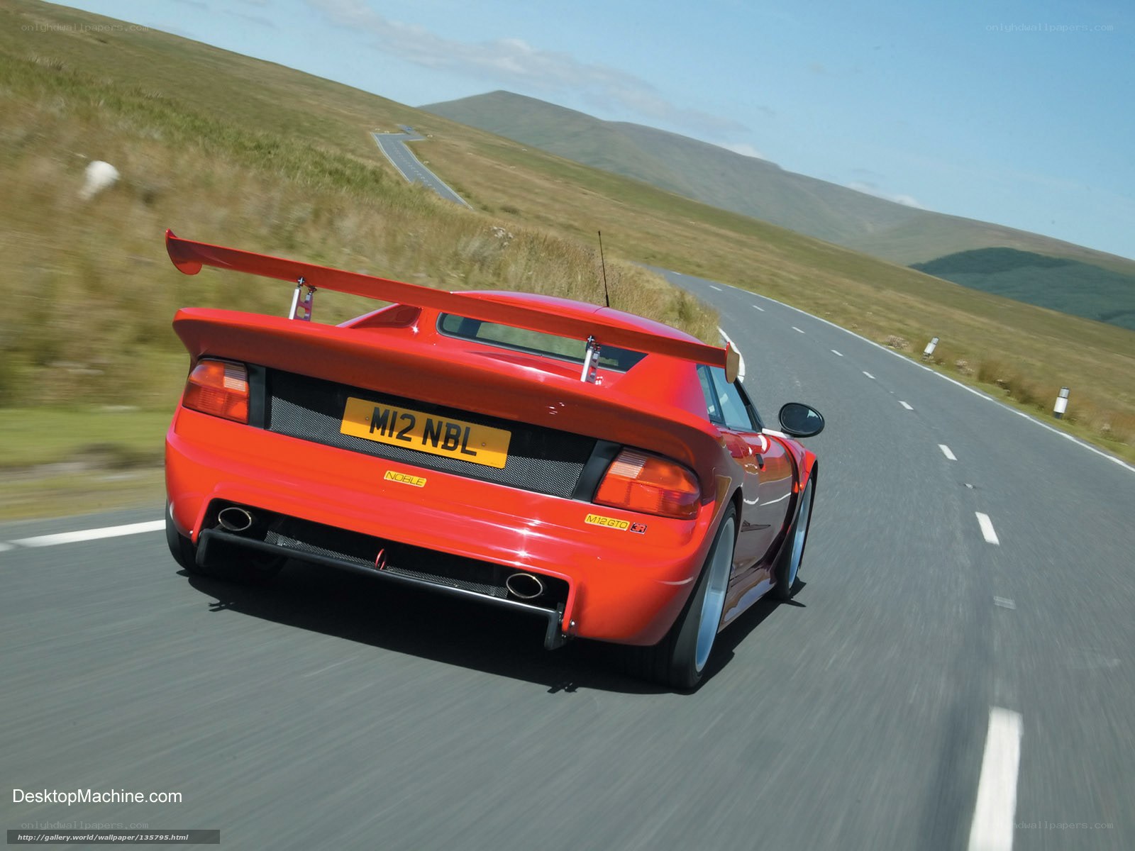 red sports car on winding road