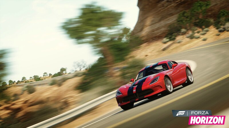 Red sports car on winding road