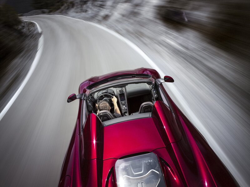 Red sports car on winding road
