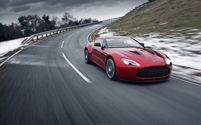Red sports car on winding road