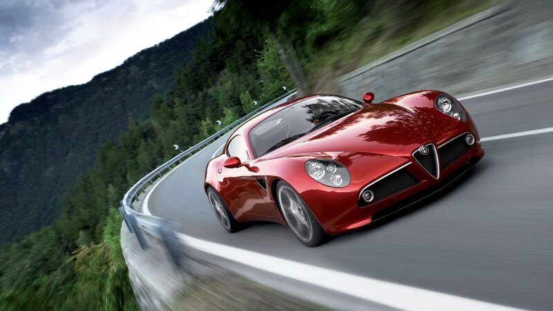Red sports car on winding road