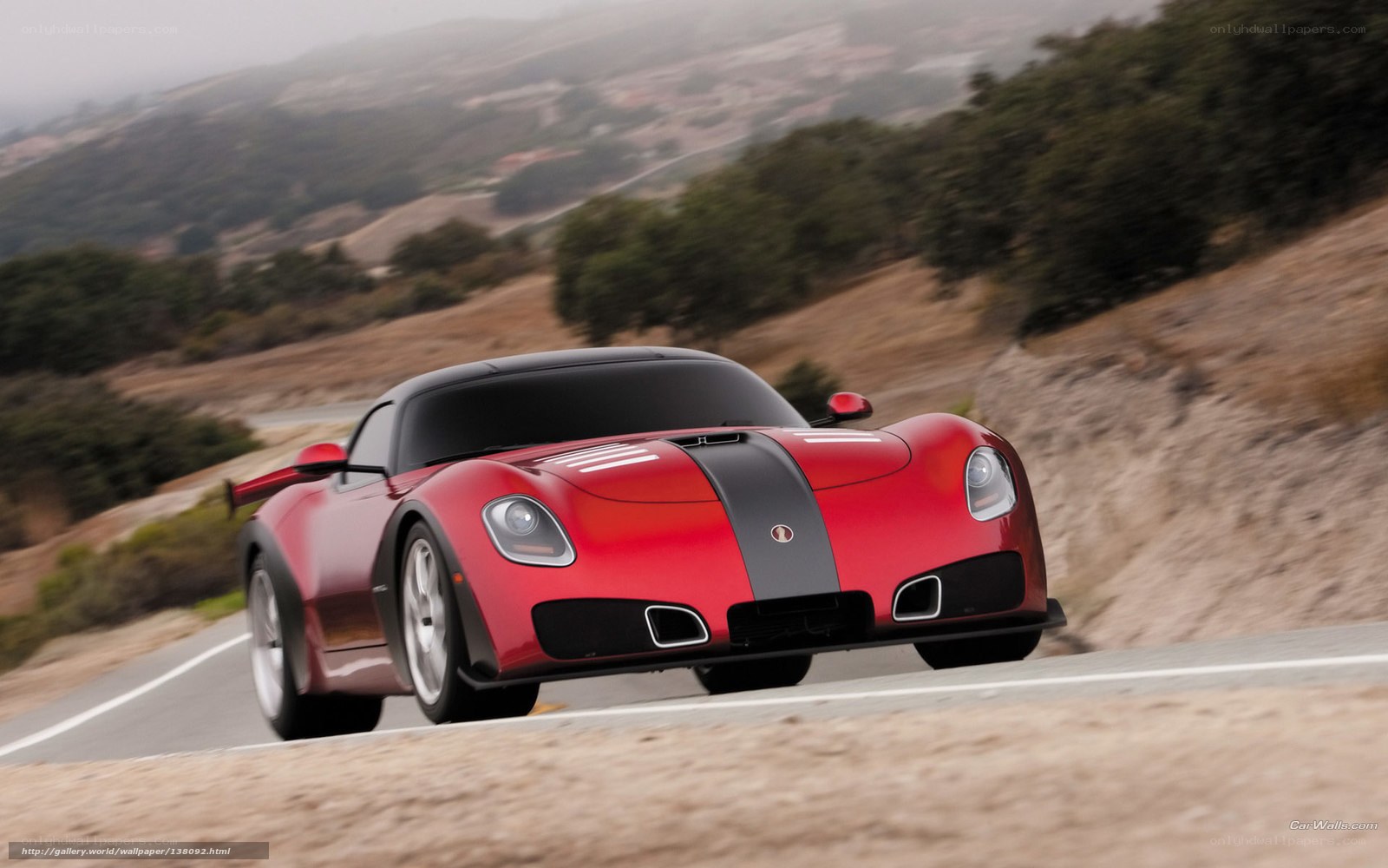 red sports car on winding road
