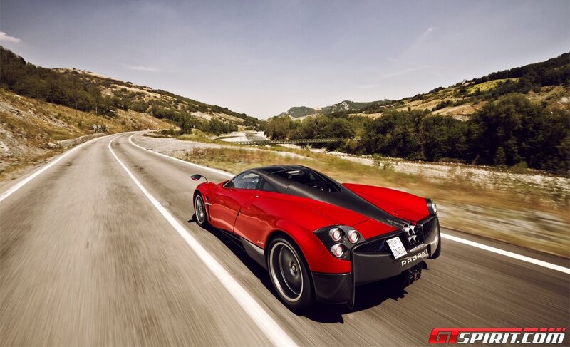 red sports car on winding road