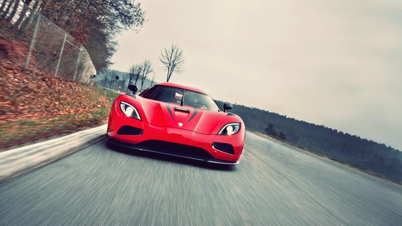 red sports car on winding road