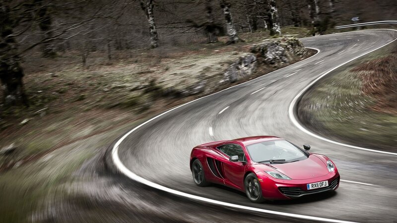 Red sports car on winding road