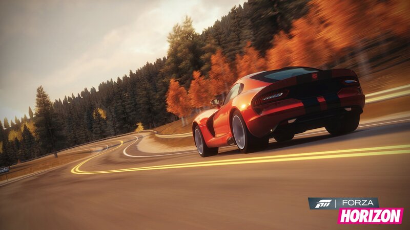 Red sports car on winding road