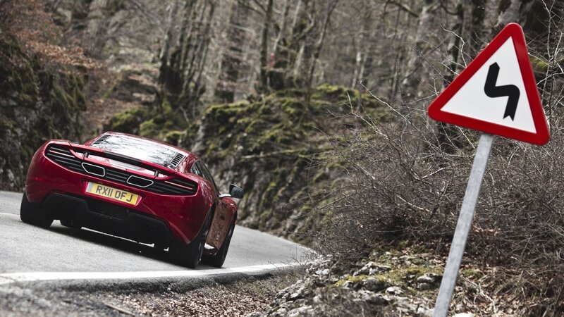 Red sports car on winding road