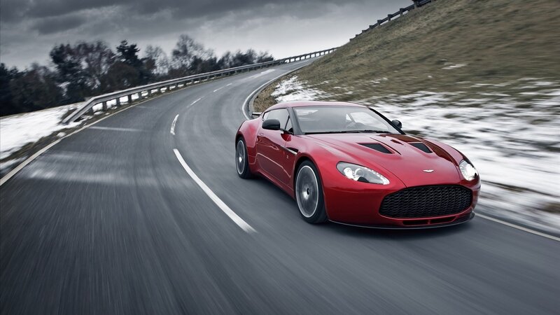 Red sports car on winding road
