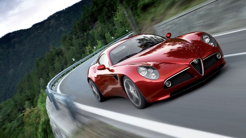 Red sports car on winding road