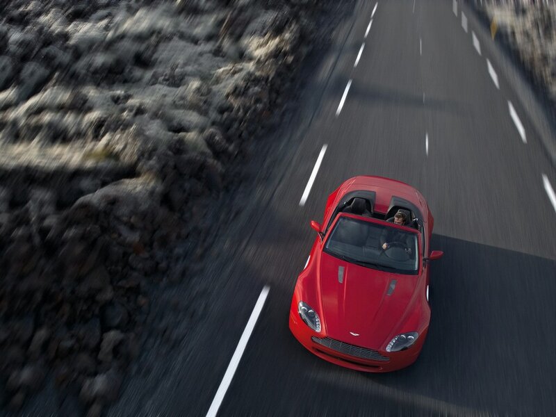 Red sports car on winding road