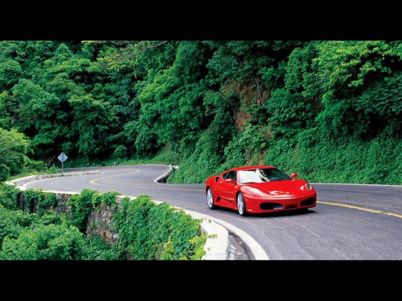 Red sports car on winding road