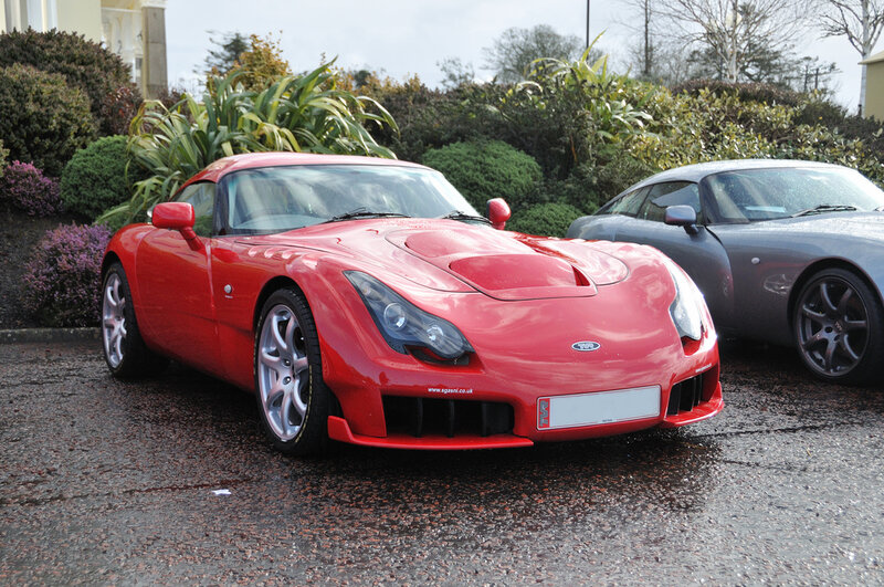 Red sports car parked outside