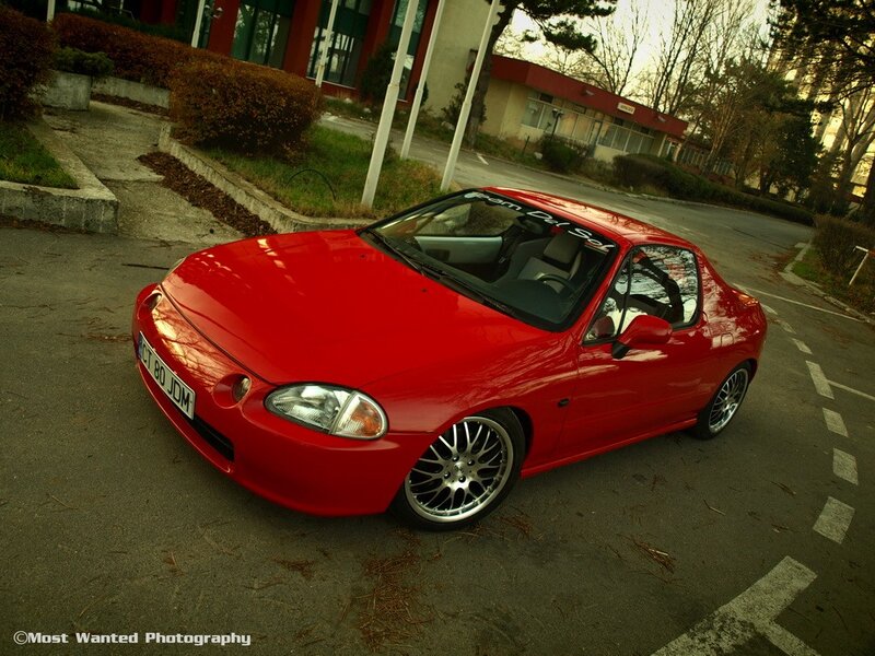 Red sports car parked outside