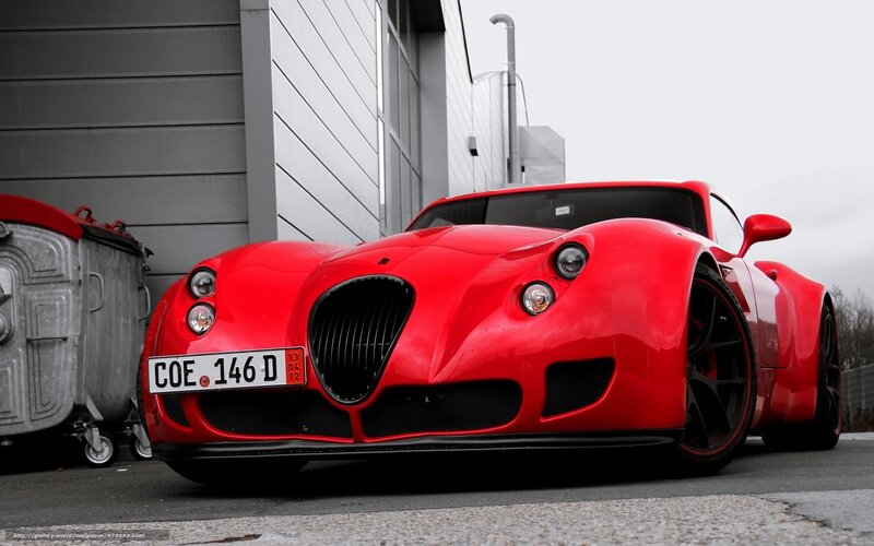 Red sports car parked outside
